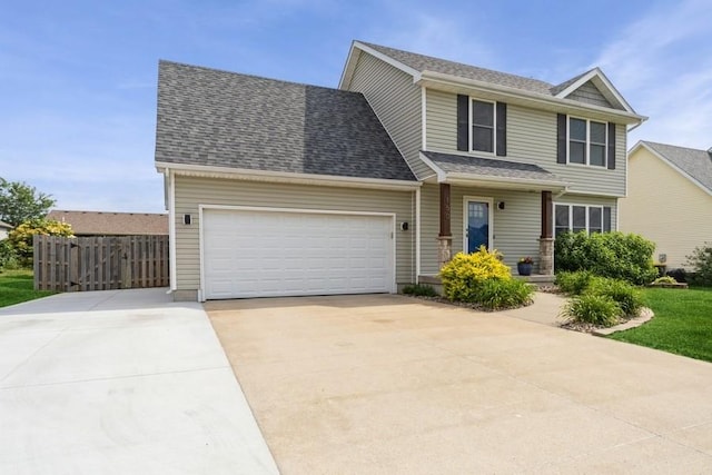 150 SE Hazelwood Dr, Waukee, IA 50263 - view of front facade with driveway, a garage, and a shingled roof