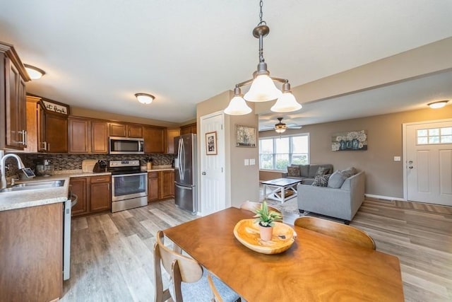 150 SE Hazelwood Dr, Waukee, IA 50263 - dining space featuring plenty of natural light, light wood-type flooring, and ceiling fan