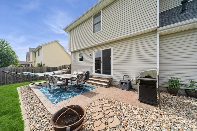 150 SE Hazelwood Dr, Waukee, IA 50263 - fenced backyard with entry steps, area for grilling, and a patio