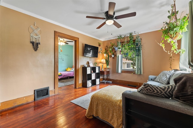 2355 Saylor Rd, Des Moines, IA 50313 - living area featuring wood finished floors, a ceiling fan, and ornamental molding