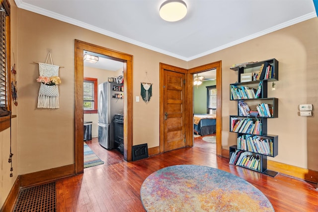 2355 Saylor Rd, Des Moines, IA 50313 - entrance foyer with dark wood-type flooring, crown molding, and a ceiling fan