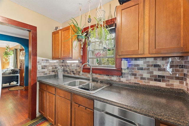 2355 Saylor Rd, Des Moines, IA 50313 - kitchen featuring dishwasher, dark countertops, plenty of natural light, and backsplash