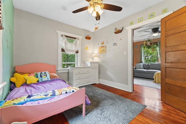 2355 Saylor Rd, Des Moines, IA 50313 - bedroom featuring wood finished floors and a ceiling fan