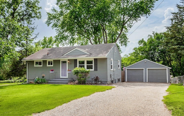 4080 SE 15th Ct, Des Moines, IA 50320 - view of front of property featuring an outbuilding, a garage, a front yard, and a shingled roof