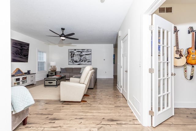 5477 S Prairie View Dr, West Des Moines, IA 50266 - living room with light wood-style flooring and a ceiling fan