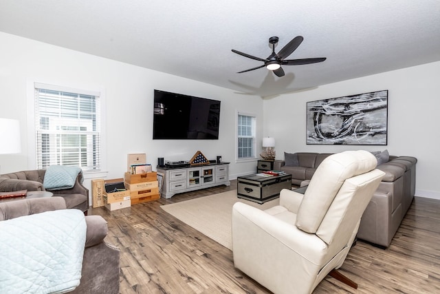 5477 S Prairie View Dr, West Des Moines, IA 50266 - living area with wood finished floors, ceiling fan, and healthy amount of natural light