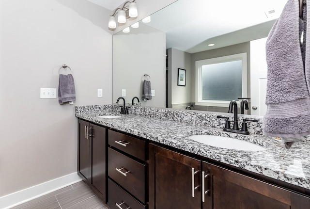 5477 S Prairie View Dr, West Des Moines, IA 50266 - full bathroom with baseboards and double vanity