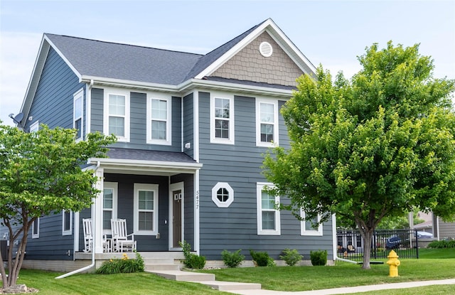 5477 S Prairie View Dr, West Des Moines, IA 50266 - view of front facade with covered porch and a shingled roof