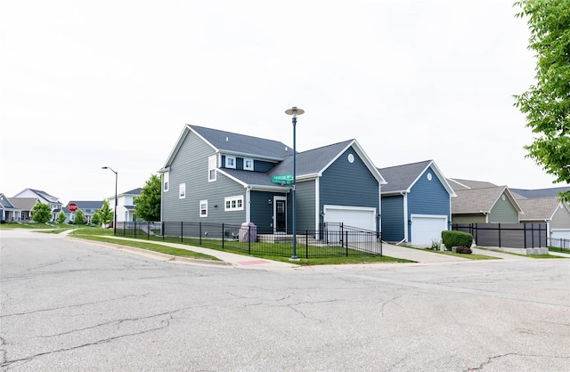 5477 S Prairie View Dr, West Des Moines, IA 50266 - view of building exterior featuring a residential view, a garage, and concrete driveway