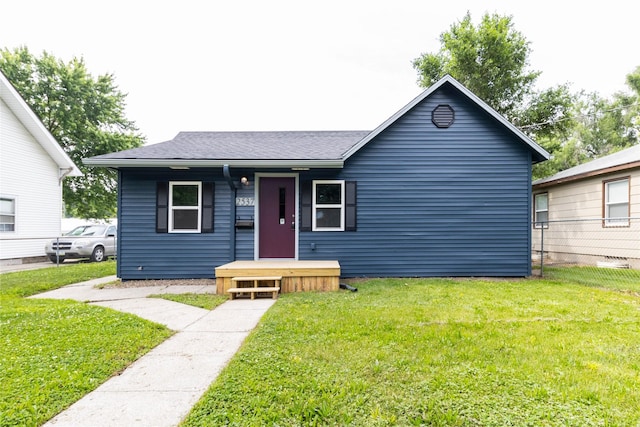2537 Maple St, Des Moines, IA 50317 - view of front facade with a front lawn and roof with shingles