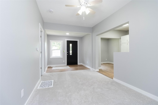 2537 Maple St, Des Moines, IA 50317 - foyer featuring light carpet and a ceiling fan