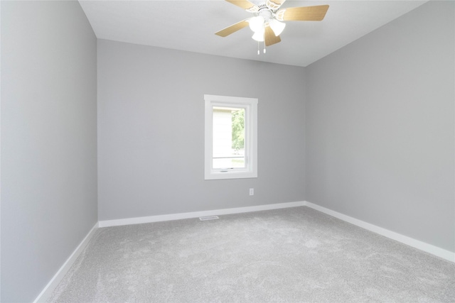 2537 Maple St, Des Moines, IA 50317 - carpeted spare room with baseboards and ceiling fan