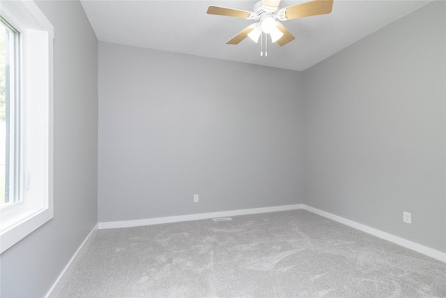 2537 Maple St, Des Moines, IA 50317 - carpeted empty room featuring a ceiling fan and baseboards