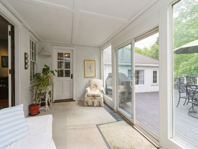 215 Foster Dr, Des Moines, IA 50312 - sunroom with coffered ceiling and a deck