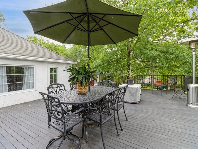 215 Foster Dr, Des Moines, IA 50312 - wooden deck featuring outdoor dining space