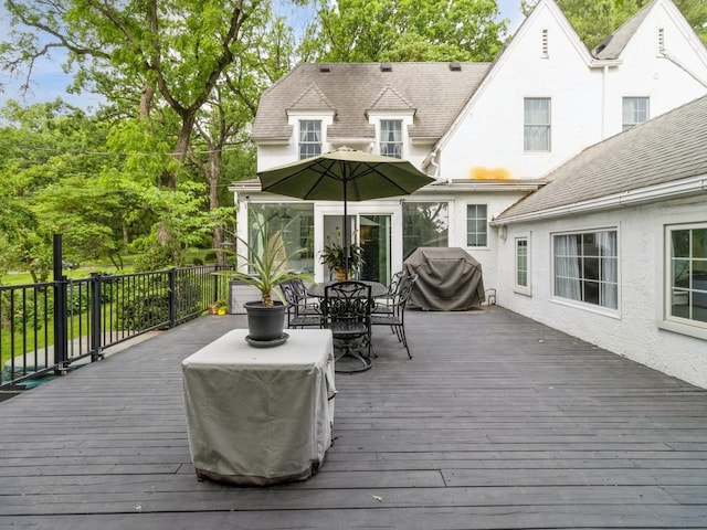 215 Foster Dr, Des Moines, IA 50312 - wooden deck featuring outdoor dining space and a grill