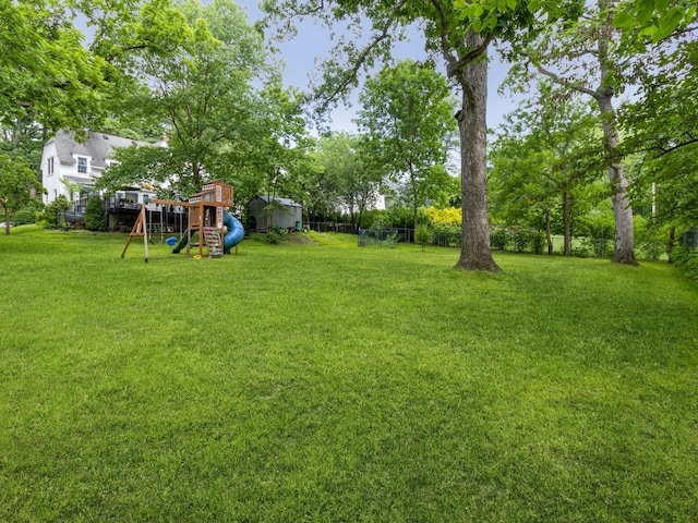 215 Foster Dr, Des Moines, IA 50312 - view of yard featuring a playground and view of scattered trees