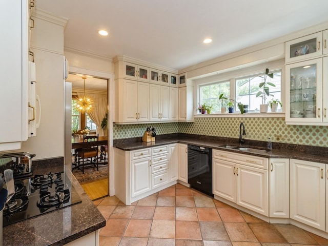 215 Foster Dr, Des Moines, IA 50312 - kitchen featuring black appliances, tasteful backsplash, dark stone counters, glass insert cabinets, and recessed lighting