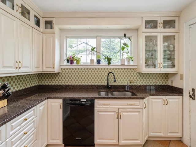 215 Foster Dr, Des Moines, IA 50312 - kitchen with black dishwasher, backsplash, dark stone countertops, and glass insert cabinets