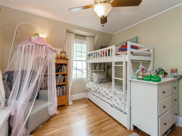 215 Foster Dr, Des Moines, IA 50312 - bedroom featuring light wood-type flooring, a ceiling fan, and crown molding