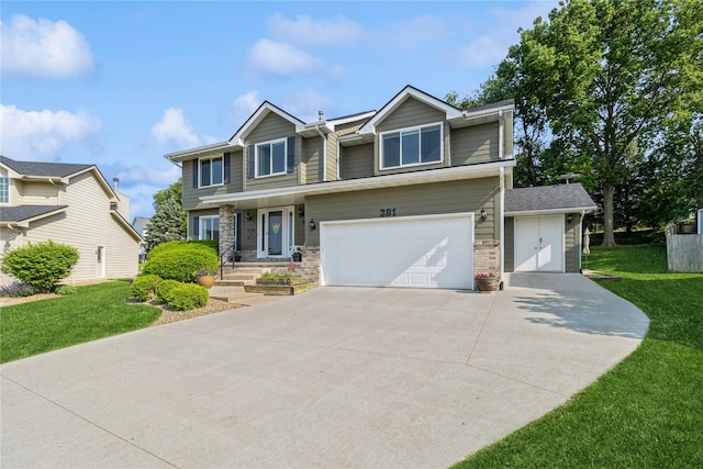 281 58th Ct, West Des Moines, IA 50266 - view of front of house featuring an attached garage, a front yard, and driveway