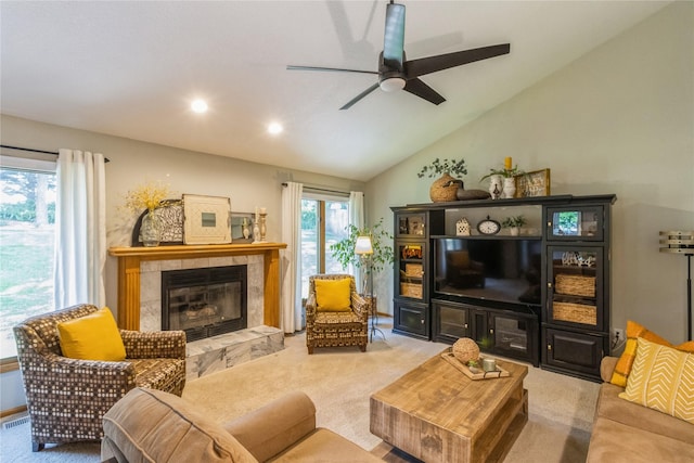 281 58th Ct, West Des Moines, IA 50266 - carpeted living area featuring a tile fireplace, ceiling fan, lofted ceiling, and recessed lighting