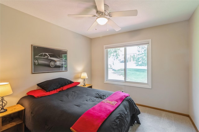 281 58th Ct, West Des Moines, IA 50266 - carpeted bedroom with baseboards and a ceiling fan