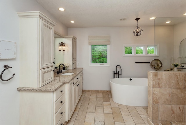 5395 NW 72nd Pl, Johnston, IA 50131 - full bath with vanity, recessed lighting, and a freestanding tub
