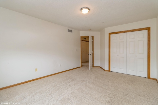 8610 Ep True Pkwy Unit 14002, West Des Moines, IA 50266 - unfurnished bedroom featuring light colored carpet and a closet