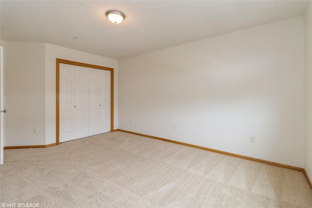 8610 Ep True Pkwy Unit 14002, West Des Moines, IA 50266 - unfurnished bedroom with carpet flooring and a closet