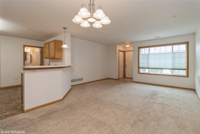 8610 Ep True Pkwy Unit 14002, West Des Moines, IA 50266 - unfurnished living room featuring a chandelier and light colored carpet