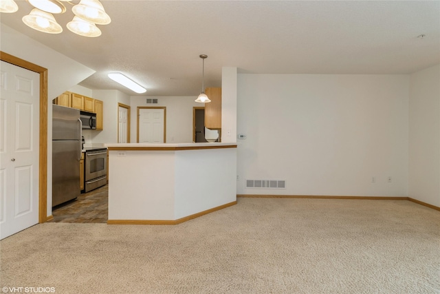8610 Ep True Pkwy Unit 14002, West Des Moines, IA 50266 - kitchen featuring stainless steel appliances, carpet flooring, pendant lighting, and a chandelier