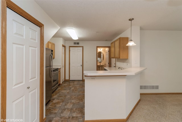 8610 Ep True Pkwy Unit 14002, West Des Moines, IA 50266 - kitchen with a peninsula, stainless steel electric range, pendant lighting, light countertops, and a textured ceiling
