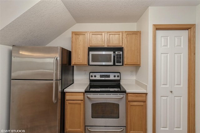 8610 Ep True Pkwy Unit 14002, West Des Moines, IA 50266 - kitchen with stainless steel appliances, a textured ceiling, and light countertops
