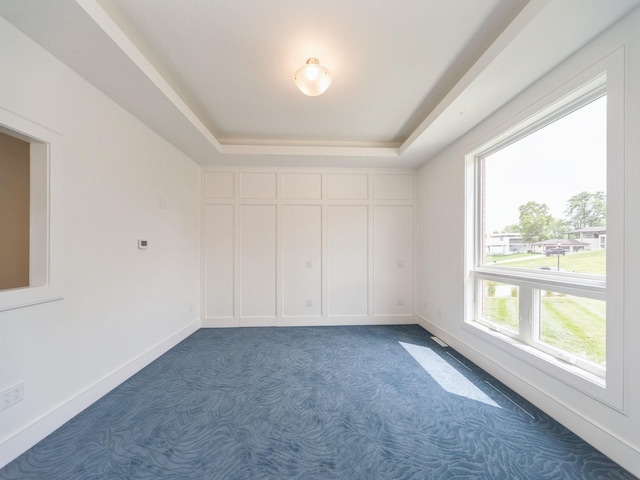 1863 Glen Oaks Dr, West Des Moines, IA 50266 - carpeted empty room with a raised ceiling and baseboards