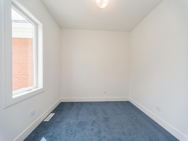 1863 Glen Oaks Dr, West Des Moines, IA 50266 - unfurnished room with dark carpet and baseboards