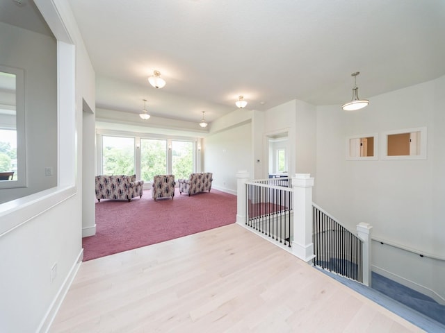 1863 Glen Oaks Dr, West Des Moines, IA 50266 - hall featuring an upstairs landing and wood finished floors