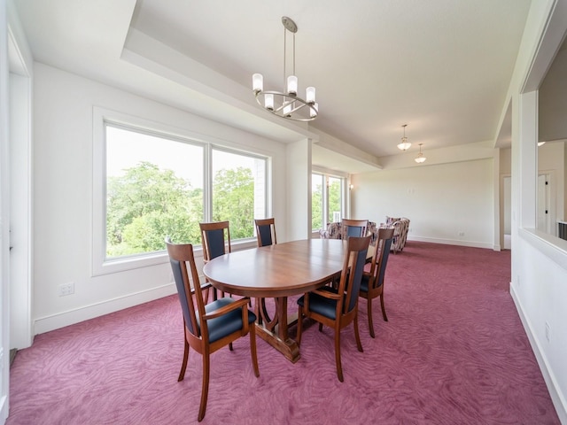 1863 Glen Oaks Dr, West Des Moines, IA 50266 - carpeted dining area with a chandelier and baseboards