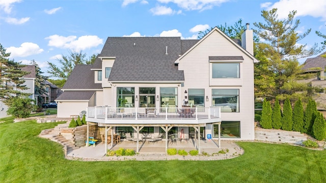 1720 Cedarwood Cir, Clive, IA 50325 - rear view of property featuring a patio area, a chimney, a wooden deck, and a lawn