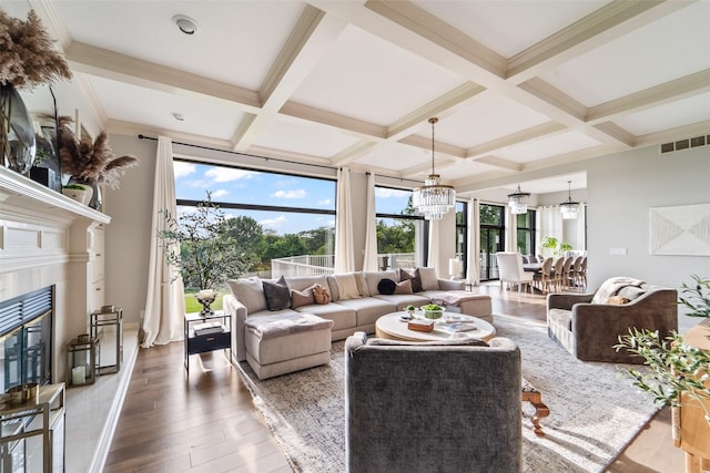 1720 Cedarwood Cir, Clive, IA 50325 - living area featuring a chandelier, wood finished floors, coffered ceiling, healthy amount of natural light, and beam ceiling
