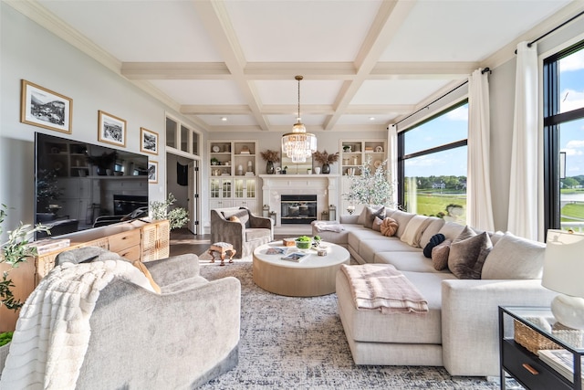 1720 Cedarwood Cir, Clive, IA 50325 - living area featuring beam ceiling, coffered ceiling, a glass covered fireplace, and built in shelves