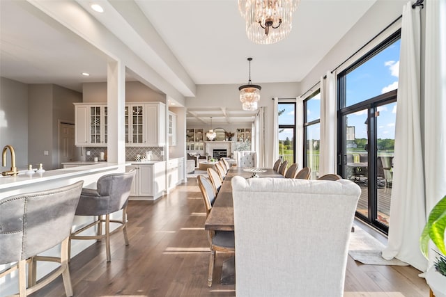 1720 Cedarwood Cir, Clive, IA 50325 - dining space with a chandelier, recessed lighting, and dark wood-style flooring