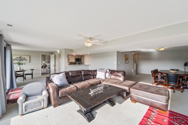 1720 Cedarwood Cir, Clive, IA 50325 - carpeted living area featuring a ceiling fan