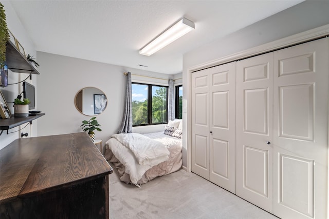 1720 Cedarwood Cir, Clive, IA 50325 - bedroom with light carpet and a closet