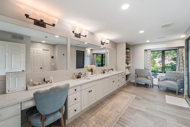 1720 Cedarwood Cir, Clive, IA 50325 - bathroom with healthy amount of natural light, double vanity, and recessed lighting