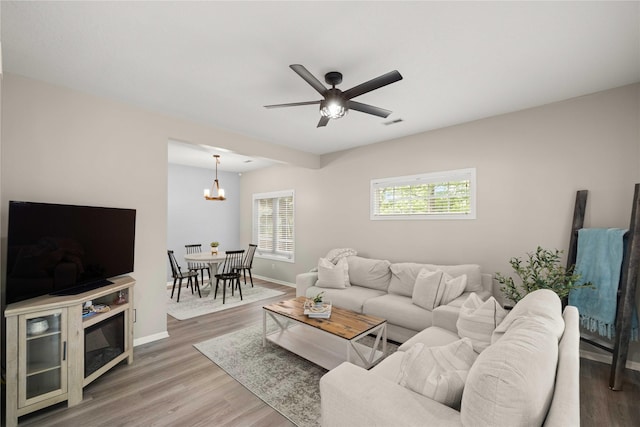 1117 S 52nd St Unit 1705, West Des Moines, IA 50265 - living room with a chandelier, wood finished floors, and ceiling fan