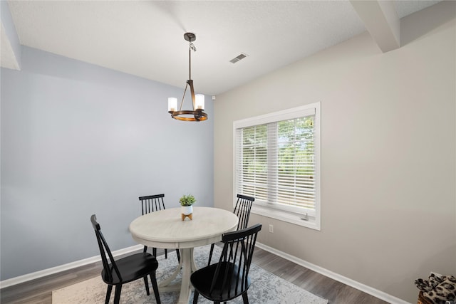 1117 S 52nd St Unit 1705, West Des Moines, IA 50265 - dining space featuring dark wood-style flooring and a chandelier