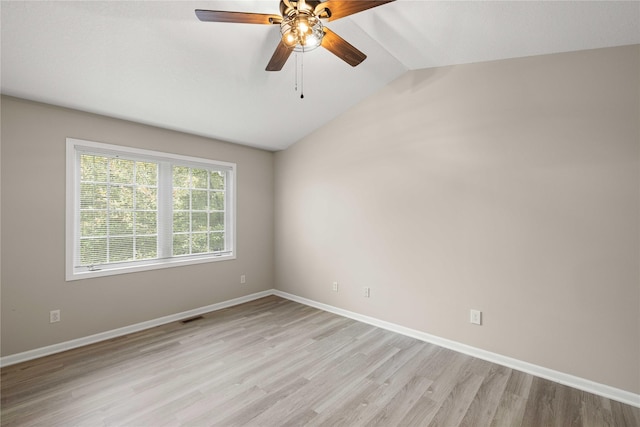 1117 S 52nd St Unit 1705, West Des Moines, IA 50265 - spare room featuring lofted ceiling, light wood finished floors, and a ceiling fan