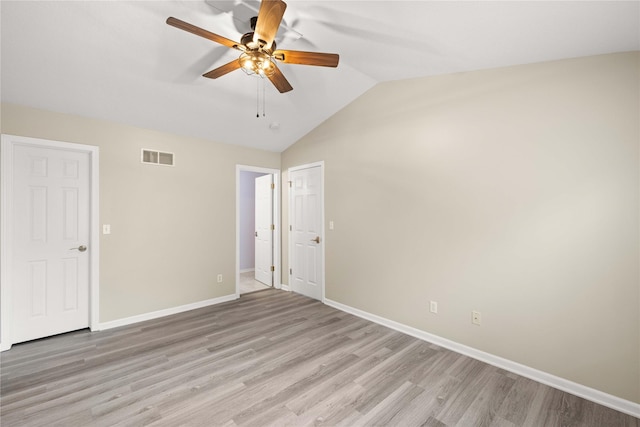 1117 S 52nd St Unit 1705, West Des Moines, IA 50265 - unfurnished bedroom featuring vaulted ceiling, light wood-style floors, and ceiling fan