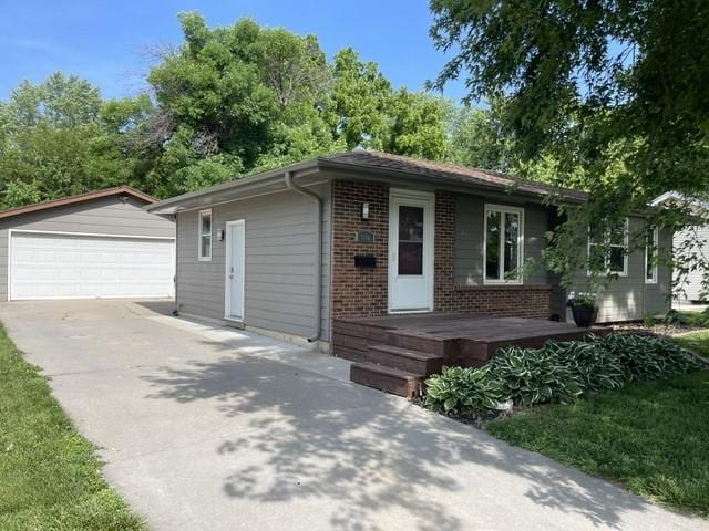 316 NW Linden St, Ankeny, IA 50023 - ranch-style house with a garage, an outbuilding, and brick siding